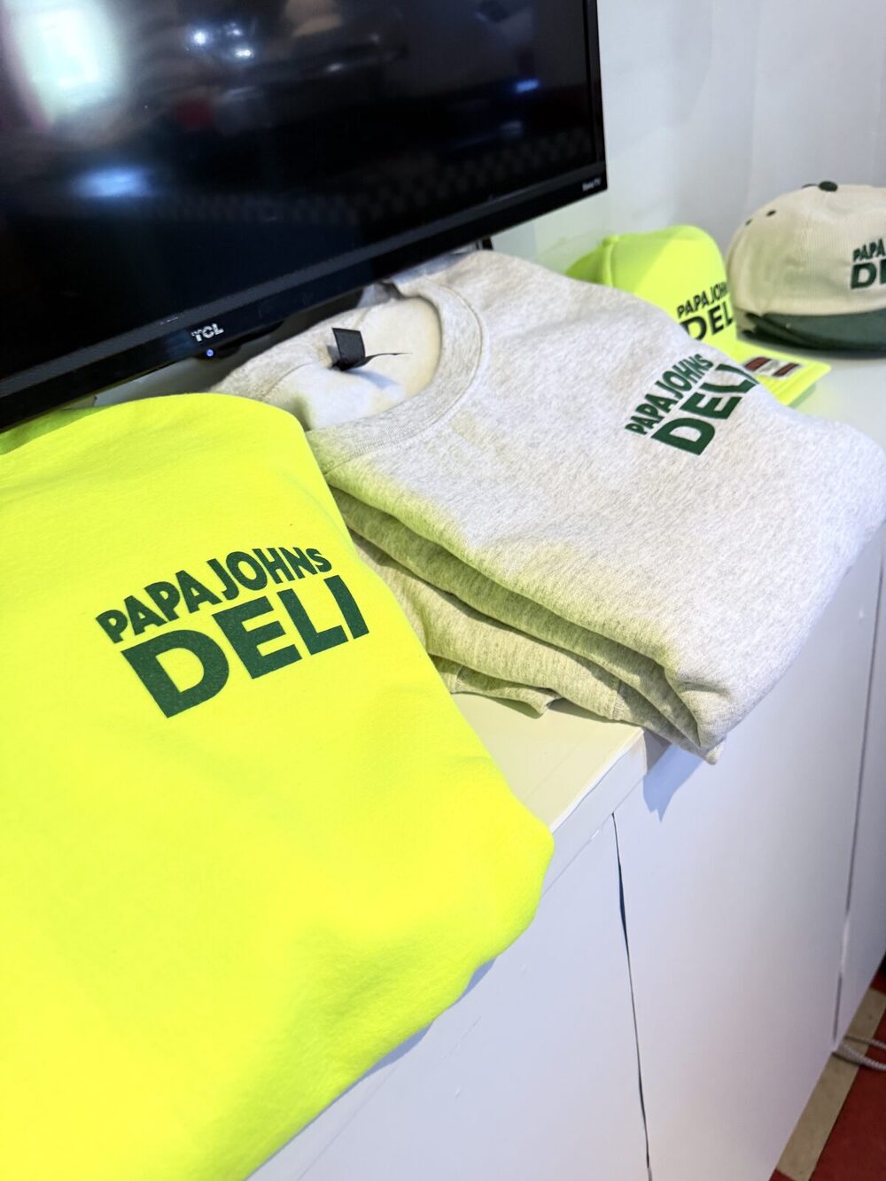 Freshly printed swag laid out and cooling before handoff to attendees